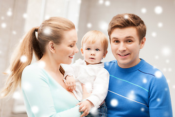 Image showing happy parents playing with adorable baby