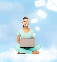 Image showing woman sitting on the cloud with laptop