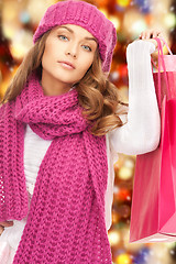 Image showing woman in winter clothes with shopping bags