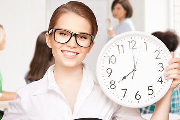 Image showing student showing clock