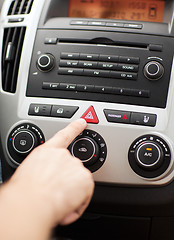 Image showing man pressing car hazard warning button