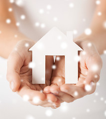 Image showing woman hands holding paper house