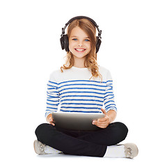 Image showing child with headphones and tablet pc