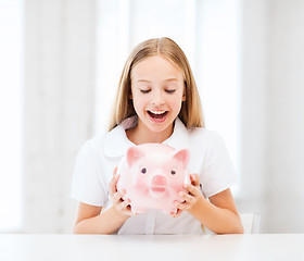 Image showing child with piggy bank