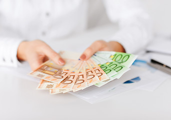 Image showing woman hands with euro cash money