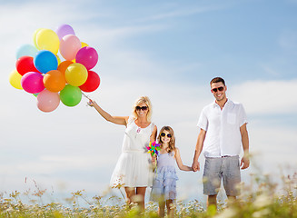 Image showing family with colorful balloons