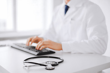 Image showing male doctor typing on the keyboard