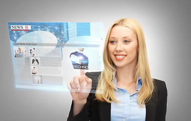 Image showing businesswoman pressing buttons on virtual screen