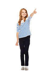 Image showing girl pointing at imaginary screen