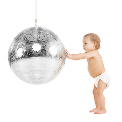 Image showing toddler playing with disco ball