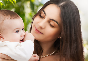 Image showing happy mother with adorable baby