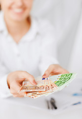 Image showing woman hands with euro cash money