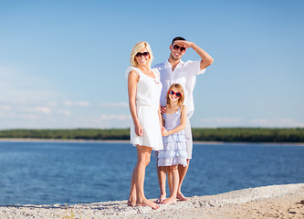 Image showing happy family with blue sky