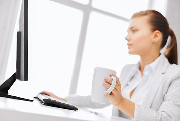 Image showing businesswoman with computer in office