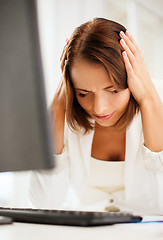 Image showing stressed woman with computer