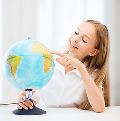 Image showing student girl with globe at school