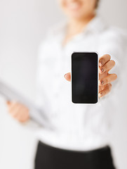 Image showing woman hand with smartphone
