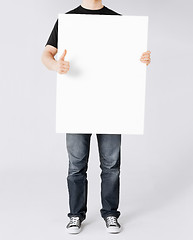 Image showing man showing white blank board and thumbs up