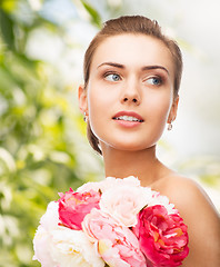 Image showing woman with diamond earrings and flowers