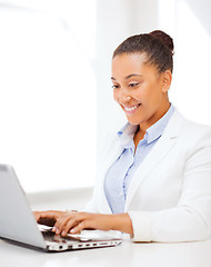 Image showing businesswoman with laptop in office