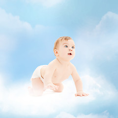 Image showing smiling baby sitting on the cloud