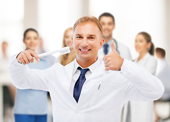 Image showing dentist with toothbrush in hospital