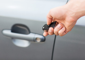 Image showing man with car key outside