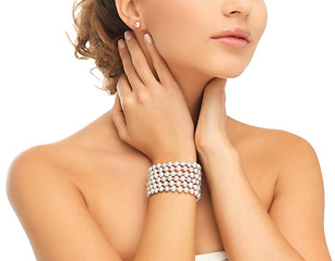 Image showing beautiful woman with pearl earrings and bracelet