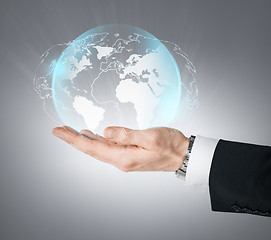 Image showing hand holding virtual sphere globe