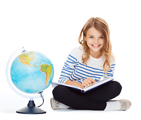 Image showing girl with globe and book