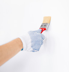 Image showing hand coloring wall with paintbrush