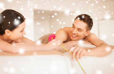 Image showing couple in spa salon lying on the massage desks