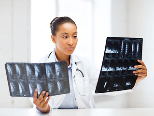 Image showing african doctor looking at x-rays