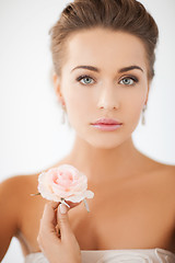 Image showing young woman with rose flower