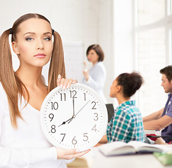 Image showing student showing clock