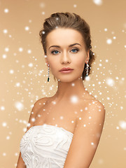 Image showing woman wearing shiny diamond earrings