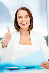 Image showing businesswoman showing thumbs up