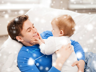 Image showing happy father with adorable baby