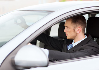 Image showing businessman driving a car