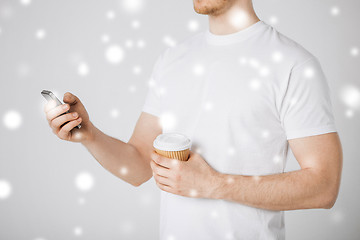 Image showing man with smartphone and coffee