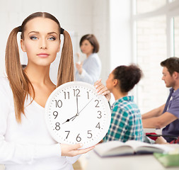 Image showing student showing clock