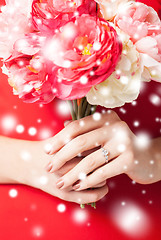 Image showing woman hands with flowers and ring