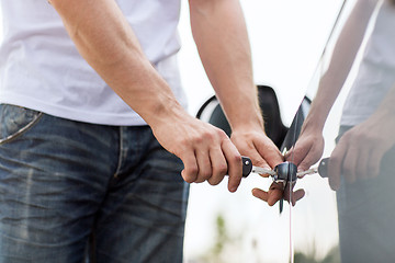 Image showing man with car key outside