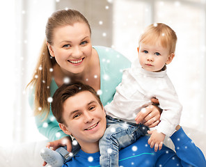 Image showing happy parents playing with adorable baby