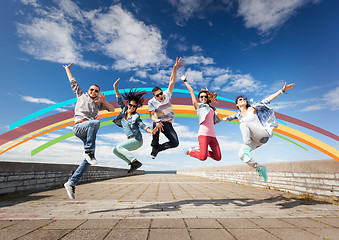 Image showing group of teenagers jumping