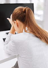 Image showing stressed woman with computer