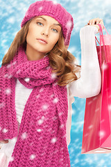 Image showing woman in winter clothes with shopping bags