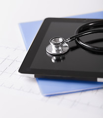 Image showing tablet pc, stethoscope and electrocardiogram
