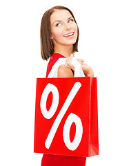 Image showing woman in red dress with shopping bags