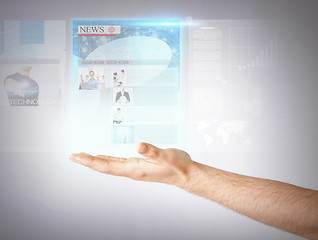 Image showing man with virtual screen and news